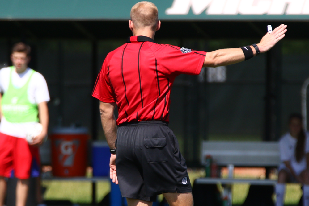 A referee signals during the 2016 MHSAA Girls Soccer Finals.