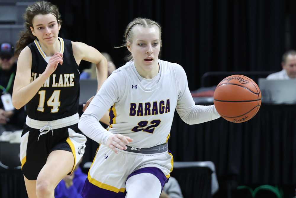 Baraga’s Corina Jahfetson (22) brings the ball upcourt during the 2023 Division 4 Final against Glen Lake at Breslin Center