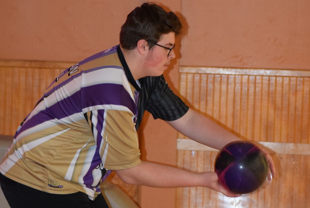 Fowlerville bowler Ethan Hall begins his approach. (2) Brent Wood shows his left-handed, left-footed bowling style. 