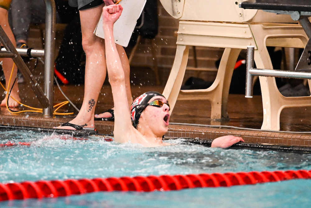 A Marquette swimmer celebrates during the UP Finals. 