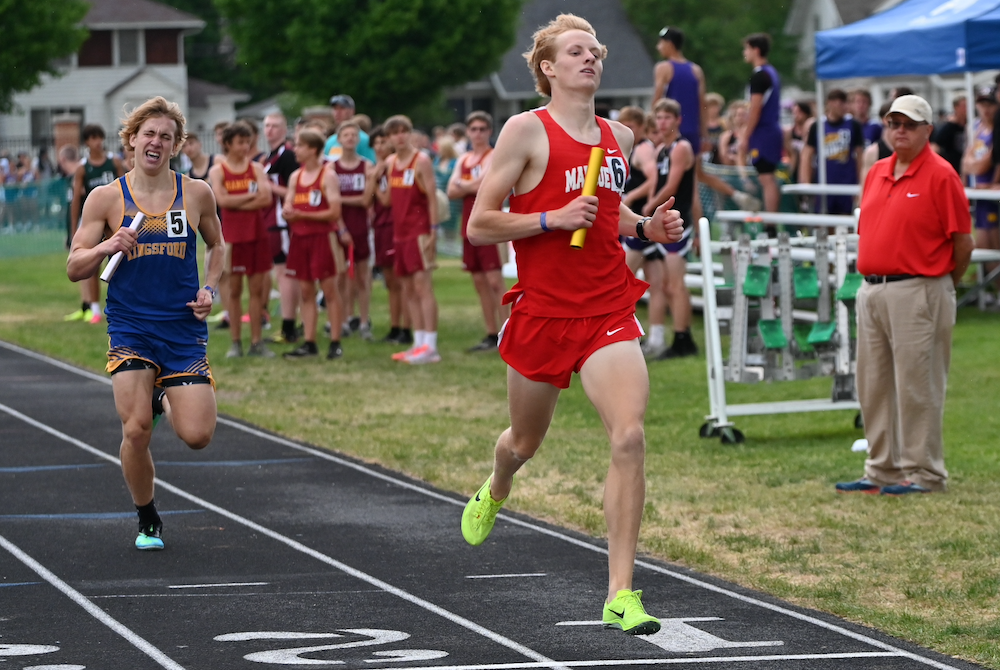 Marquette's Colin VanderSchaaf crosses the finish line first in the 1,600 relay Saturday.