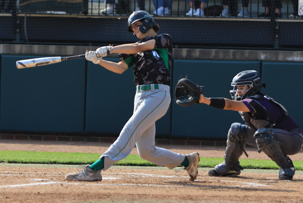 A Novi hitter drives a pitch during Saturday's first championship game at McLane Stadium. 