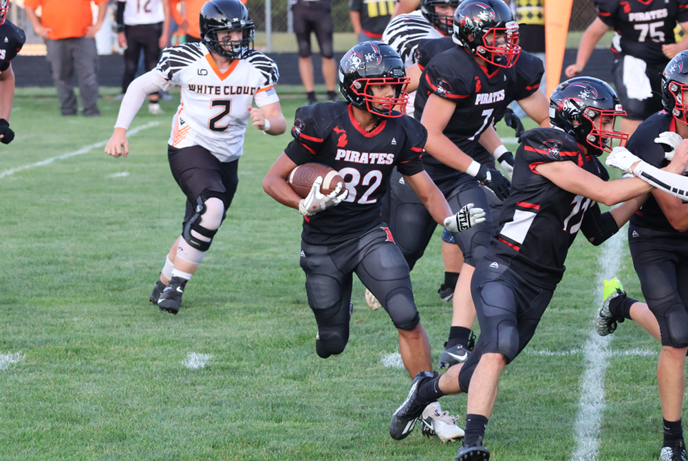 Senior tailback Joseluis Andaverde runs the ball in a game against White Cloud on Aug. 31.