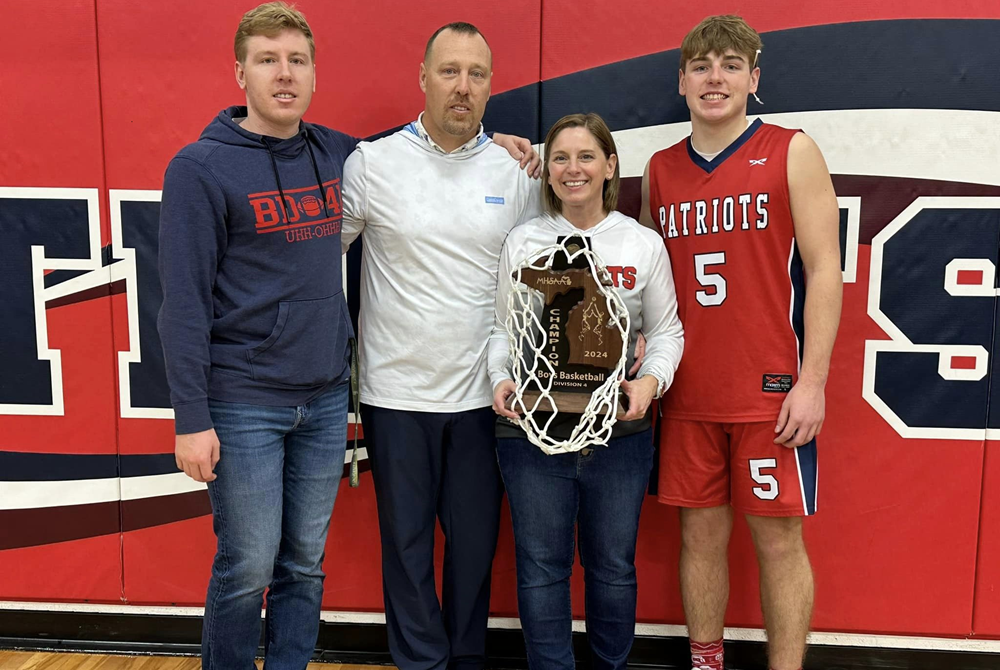 From left: Cole Shiels, Darren Shiels, Kelly Shiels and Logan Shiels. Darren is the varsity boys basketball coach at Britton Deerfield, Kelly is the longtime scorekeeper and Logan and Cole have both played for their father. 