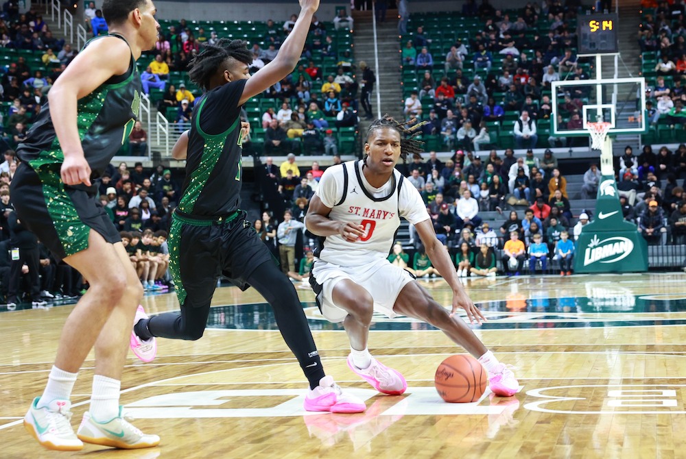 Sharod Barnes (0) makes a move into the lane during Orchard Lake St. Mary’s Semifinal win Friday at Breslin Center.