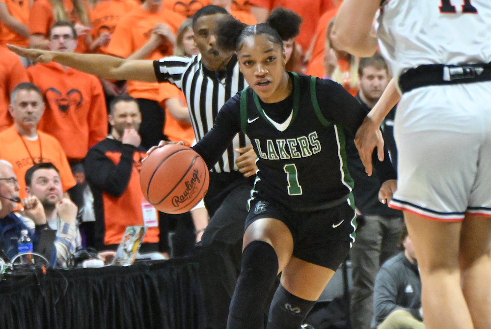 West Bloomfield’s Destiny Washington (1) brings the ball up the court during Friday’s Division 1 Semifinal at Breslin Center. 