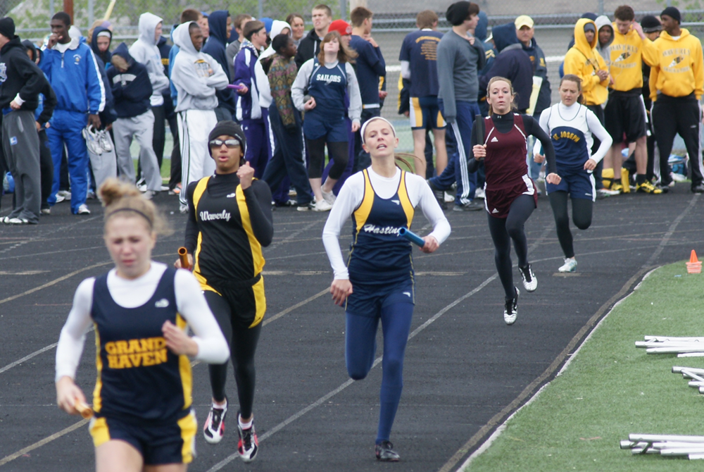 Racers run at the Hastings Relays, with several more awaiting their turns to compete at the longtime meet. 