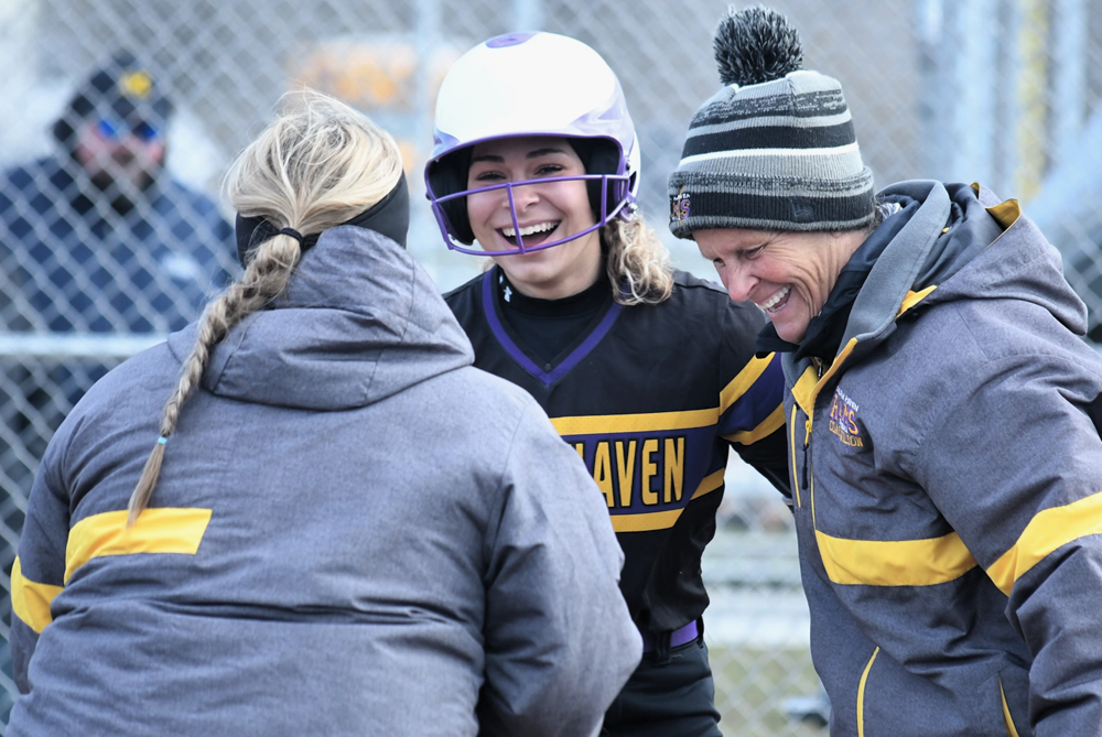 South Haven softball coach Wilma Wilson, right, welcomes home Kamryn Holland after Holland’s grand slam March 26. 