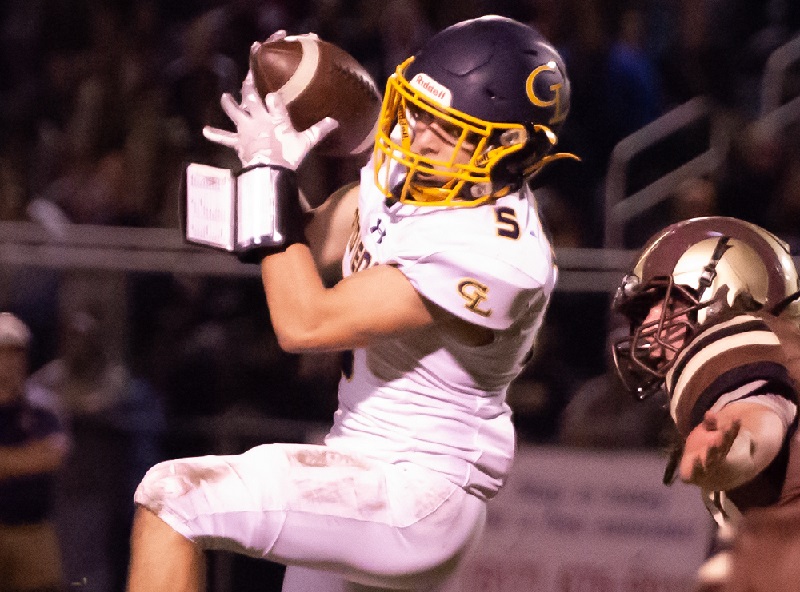 A Grand Ledge receiver hauls in a pass against Holt.
