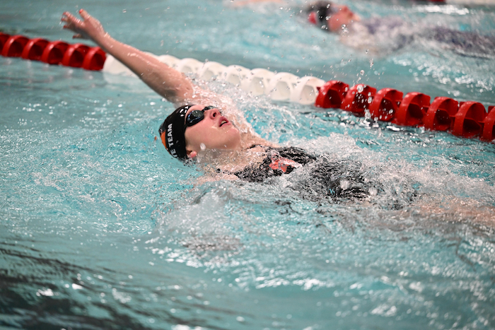 A Houghton athlete swims the backstroke. 