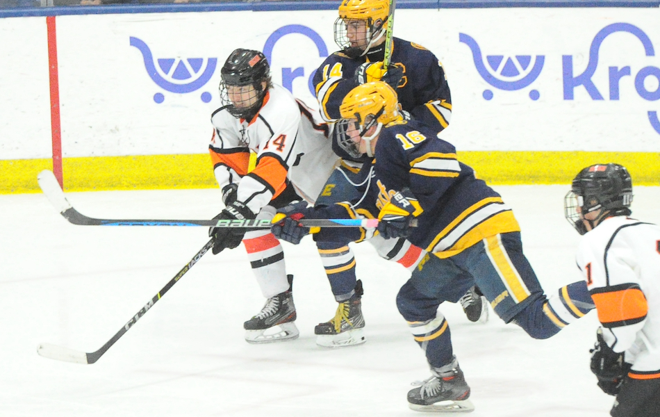 East Grand Rapids' Charlie Hoekstra (16) fires the game-winning overtime goal with 1:11 left to play in the first extra period to give his team a 2-1 win over Houghton.