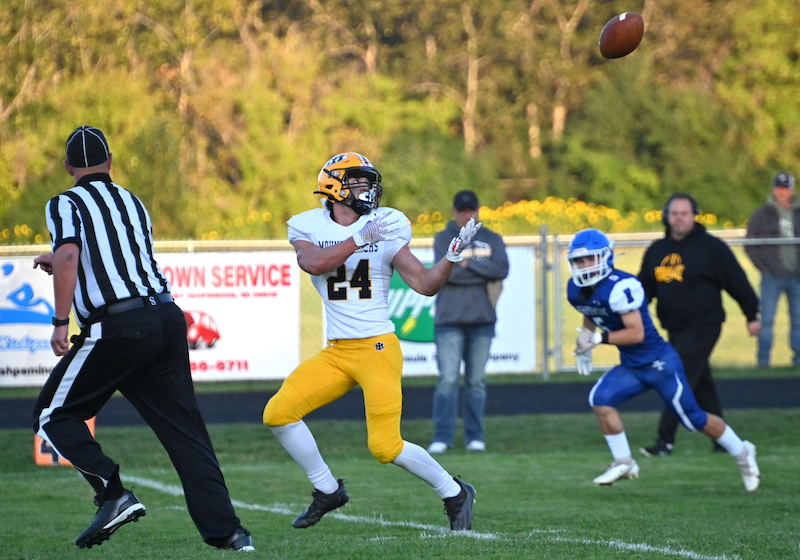 Iron Mountain's Alex Jayne prepares to pull in a pass from quarterback Ian Marttila that he runs into the end zone.