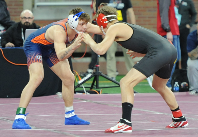 Mansfield, left, wrestles during the first round of last season’s Individual Finals at Ford Field. 