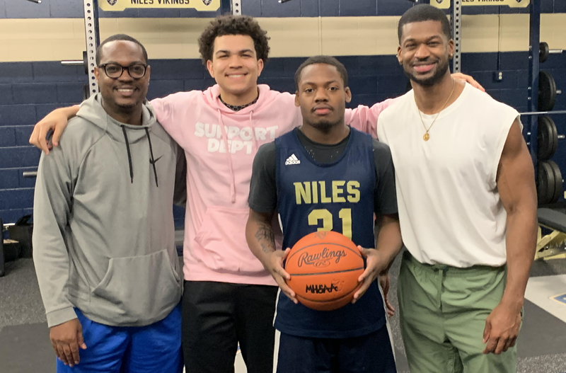 From left: Niles assistant boys basketball coach Desmond Favors, Brayden Favors, Mike Phillips Jr., and head coach Myles Busby.