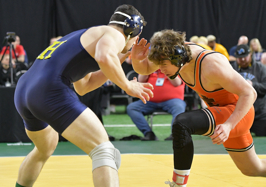 Alma’s Cole O’Boyle, right, works for an opening against Hillsdale’s Stephen Petersen.