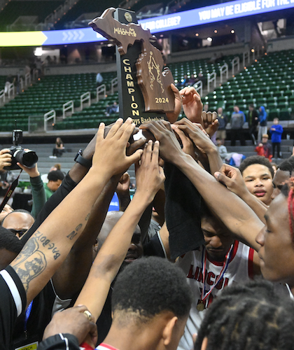 Abes players raise their championship trophy.