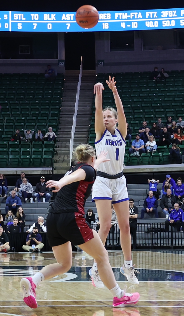 Jenna Maki (1) launches a 3-point attempt.