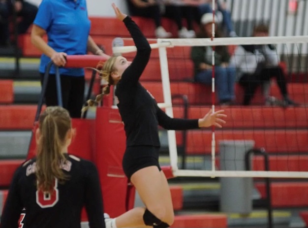 Also a standout in the fall, Marlatt prepares to connect during volleyball season.